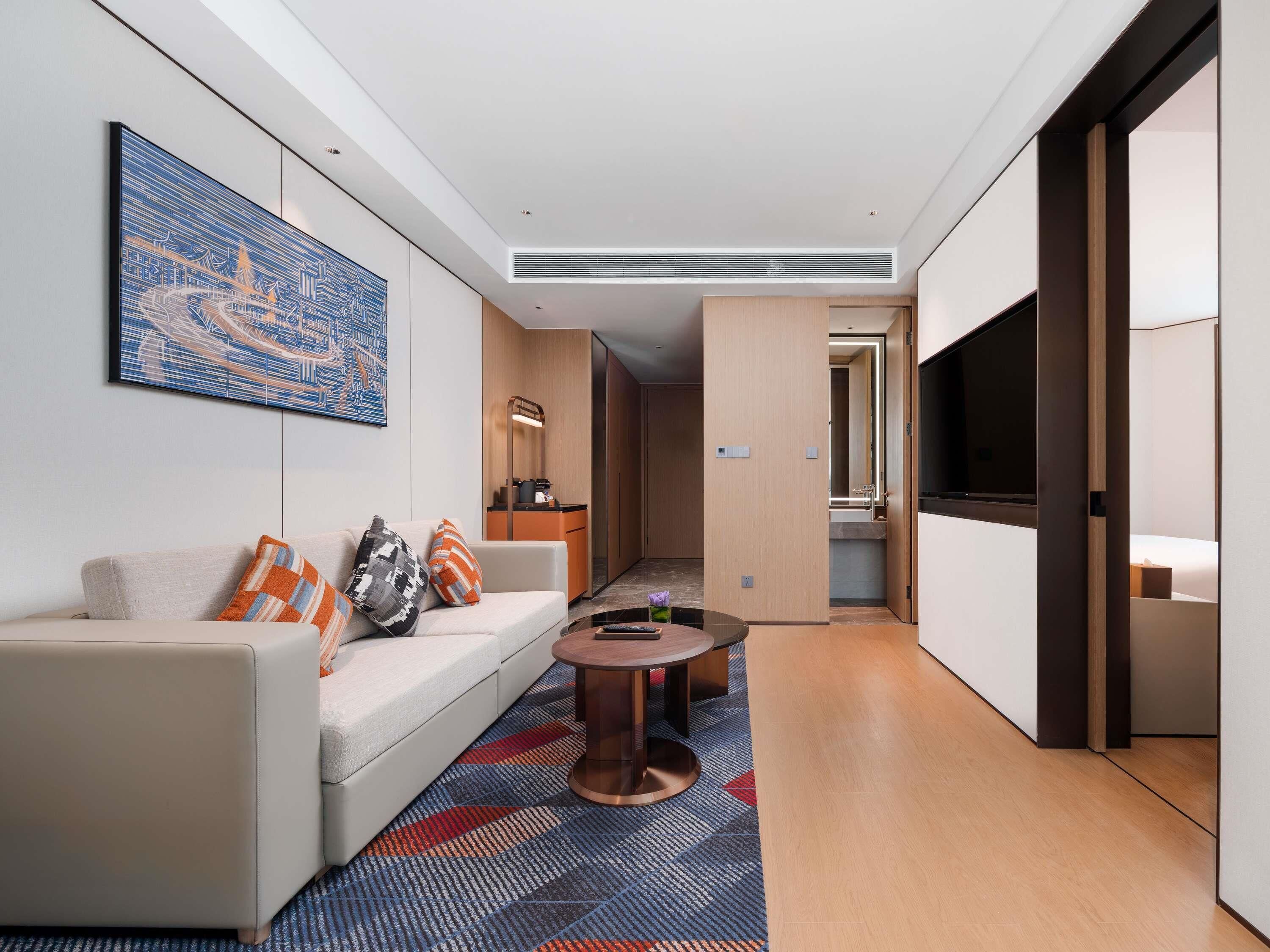 Deluxe Suite, 1 King Bed | In-room safe, desk, soundproofing, free cribs/infant beds