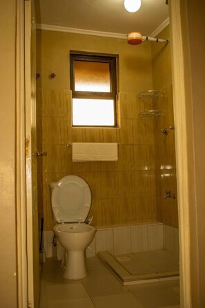 Shower, slippers, towels, soap
