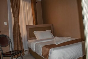 Quarto solteiro luxo, vista para o jardim | Wi-Fi de cortesia, roupa de cama