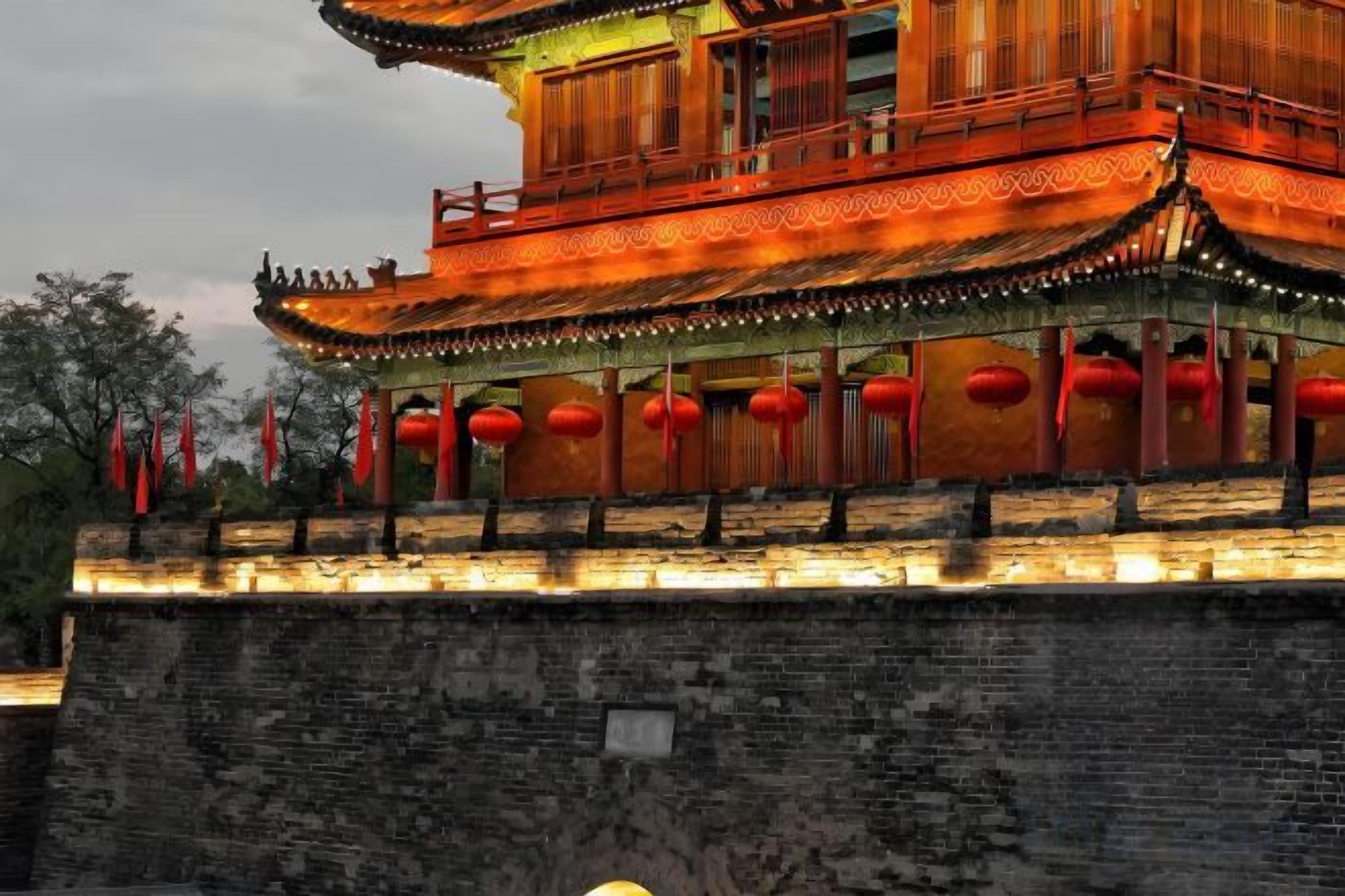 A traditional building with a tiled roof and red lanterns.