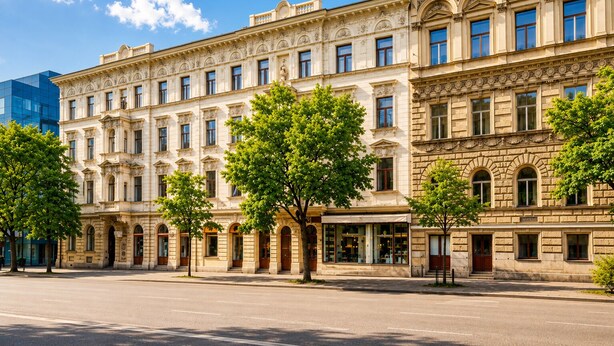 A historic building with classical architecture, multiple windows, and a tree-lined street. - Loft Jecna 43 Prague (Prague)