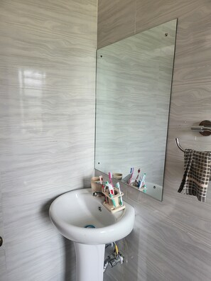 Shower, towels, soap, toilet paper