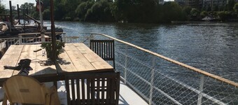 Houseboat on the Thames in London next to Kew Gardens