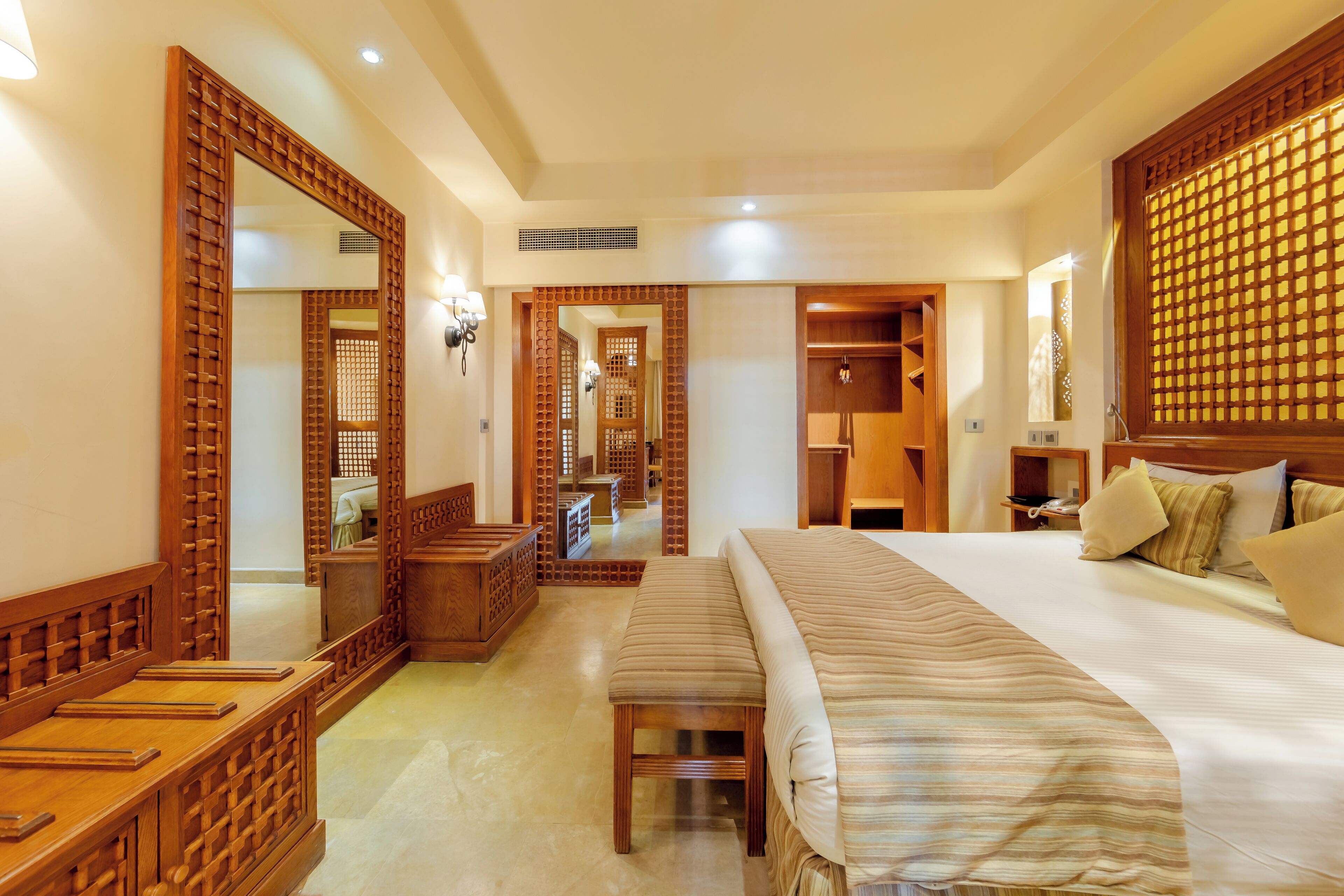 Junior Suite | Minibar, in-room safe, blackout drapes, iron/ironing board