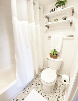 Hair dryer, towels, soap, toilet paper
