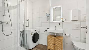 Shower, hair dryer, towels, soap