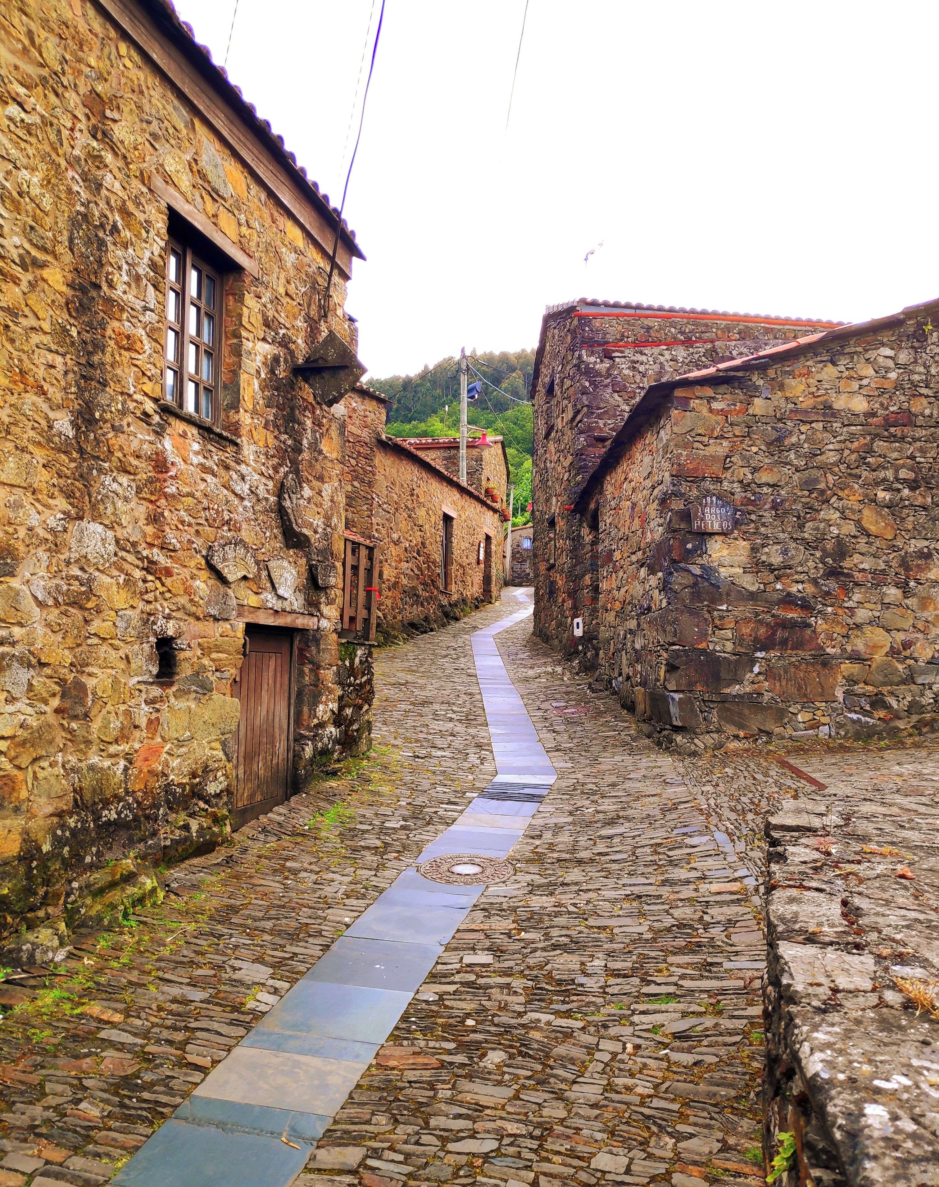 A narrow cobblestone street flanked by stone buildings with traditional architecture, a clear sky, and a date stamp indicating 2024/5/7 19:44.