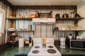 Fridge, microwave, stovetop, coffee/tea maker