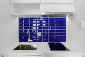 Family Apartment | Private kitchen | Mini-fridge, microwave, electric kettle, cookware/dishes/utensils