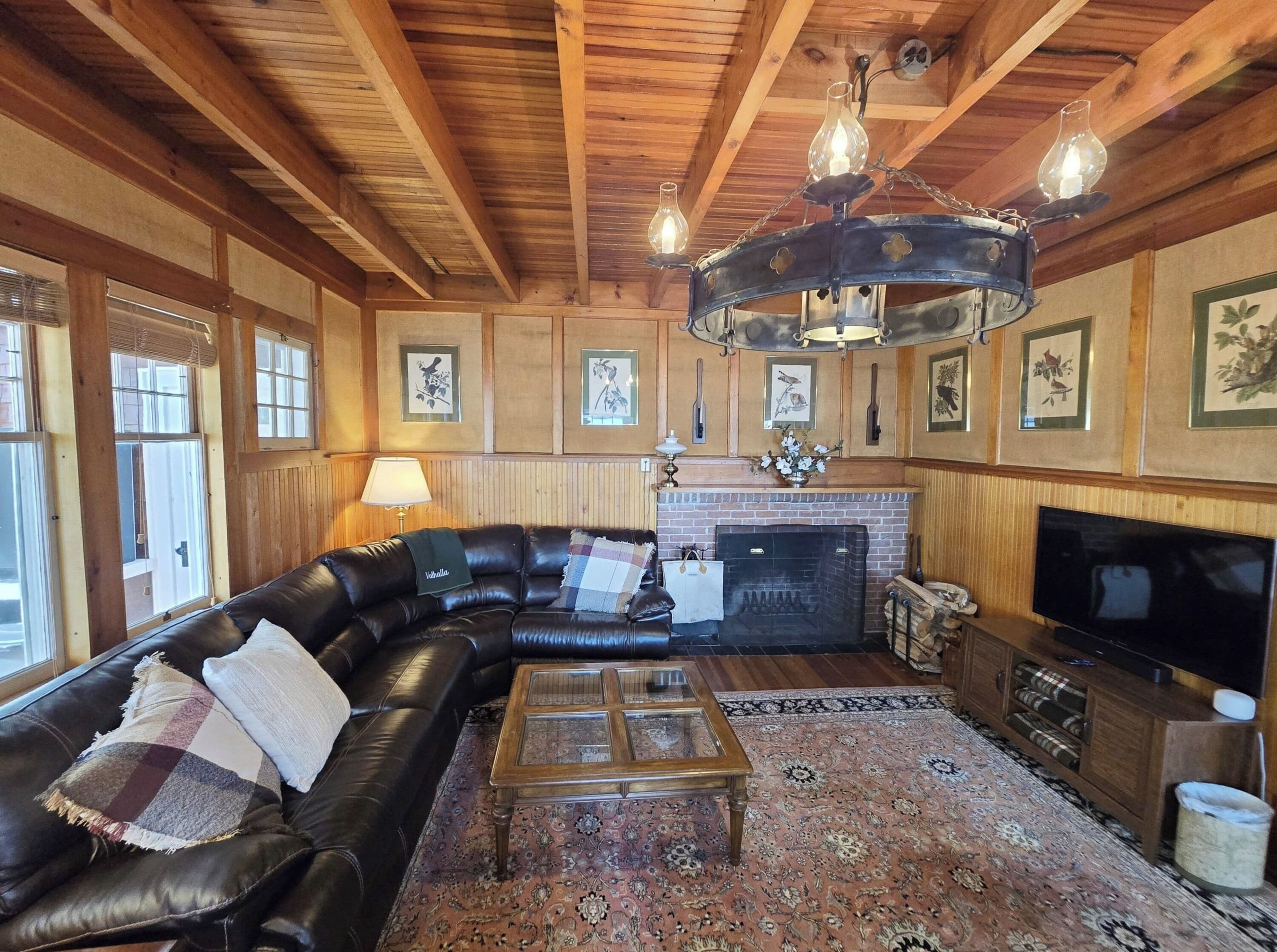 Signature House, Multiple Beds, Patio, Lake View | Living room | 50-inch Smart TV with digital channels, fireplace, books