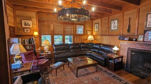 Signature House, Multiple Beds, Patio, Lake View | Living room | 50-inch Smart TV with digital channels, fireplace, books