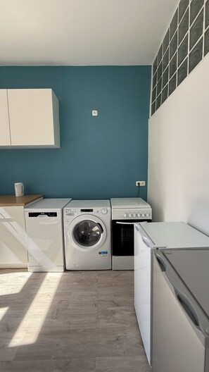 Mini-fridge, stovetop, cookware/dishes/utensils