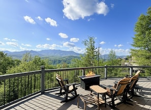 A deck with outdoor furniture, a fire pit, and a scenic mountain view. - Dayna`s Star Gazer Hot Tub (Gatlinburg)
