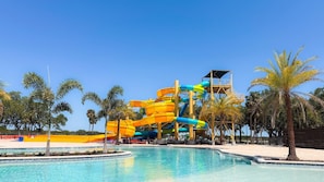 A water park with multiple slides and a pool.