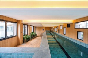 Indoor pool, outdoor pool, pool umbrellas, sun loungers
