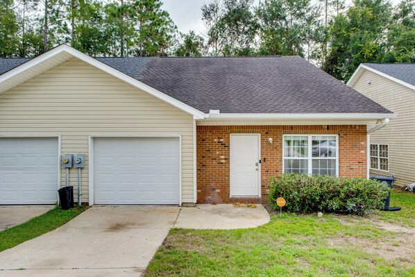A single-story house with a garage, a brick section, and a small front yard with a bush. - 4 Mi to FSU & 5 Mi to FAMU: WFH-Friendly Hub (Tallahassee)