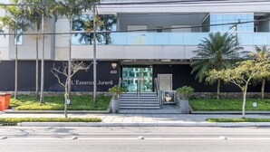 A modern building with a glass entrance, a number '400' sign, and a staircase leading to the entrance.
