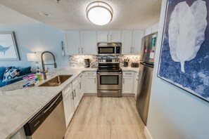 Fridge, microwave, coffee/tea maker, toaster