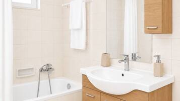 Hair dryer, towels, soap, toilet paper