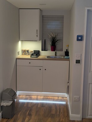 Fridge, microwave, electric kettle, cookware/dishes/utensils