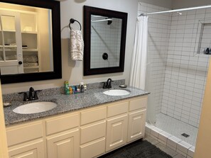 Shower, towels, soap, toilet paper