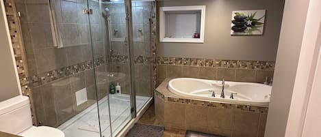 Jetted tub, hair dryer, towels, soap