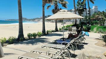 On the beach, sun loungers, beach towels