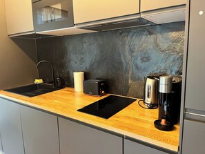Fridge, microwave, stovetop, coffee/tea maker