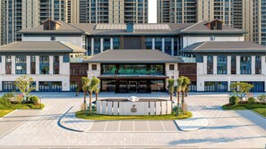 A Holiday Inn hotel with a modern facade, large windows, and a central entrance. - Holiday Inn Ningde Jiaocheng by IHG (Ningde)