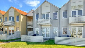 A row of modern, multi-story residential buildings with balconies and large windows. - Lovely apartment in Rudkøbing with house sea view (Rudkøbing)