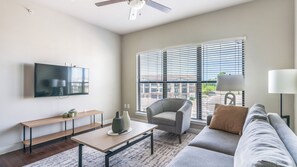 Apartment, 2 Bedrooms, 2 Bathrooms | Living area | 50-inch TV with digital channels