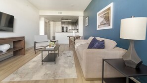 Apartment, 1 Bedroom | Living area | 50-inch TV with digital channels