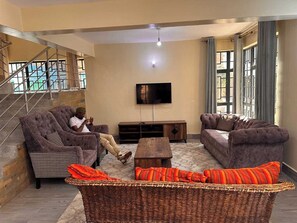 Family Villa, Garden View | Living area | 32-inch Smart TV with digital channels