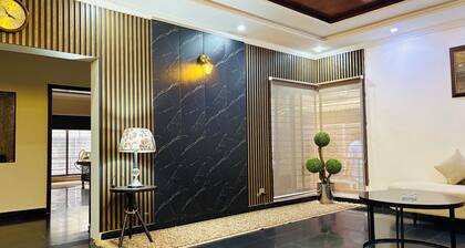 “Spacious King Rooms Prime DHA Location Perfect for Business & Family Stays