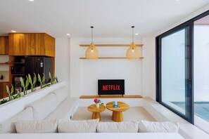 Villa Deluxe, vistas a la piscina | Zona de estar