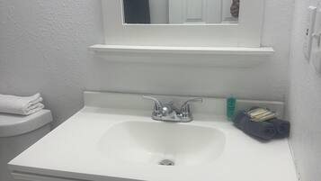 Hair dryer, towels, soap, toilet paper