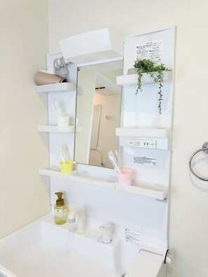 Hair dryer, towels, soap, shampoo