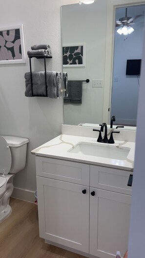Shower, hair dryer, towels, soap - Stylish Urban Retreat (Dallas)
