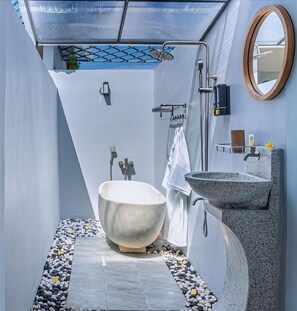 Separate tub and shower, slippers, towels, soap