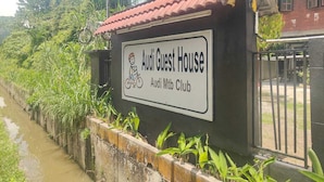 A sign for the Audi Guest House, indicating it is part of the Audi Mtb Club. - Audi Guest House (George Town)