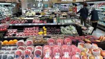 A grocery store with fresh produce and seafood sections.