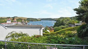 A coastal view with a marina, houses, and lush greenery. - All that Salcombe has to offer from your perfect family base. (Salcombe)