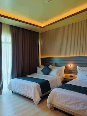 Habitación Deluxe con 2 camas individuales, patio, vistas a la playa | Wifi gratis