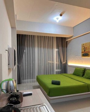 Quarto standard, vista para a cidade | Roupa de cama