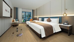 A modern hotel room with two beds, a sofa, a small table, and a nightstand. - Yizhi Hotel Shamian Pearl River Night Cruise-Canton Fair free shuttle bus included free Breakfast&Gym&Laundry&free coffee allday (Guangzhou)