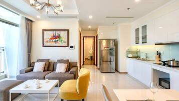 Standard Apartment, Balcony, City View | Living area | 50-inch Smart TV with digital channels