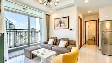 Standard Apartment, Balcony, City View | Living area | 50-inch Smart TV with digital channels