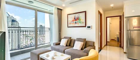 Standard Apartment, Balcony, City View | Living area | 50-inch Smart TV with digital channels