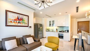 A modern living room with a sofa, a yellow armchair, and a coffee table.