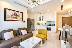 Standard Apartment, Balcony, City View | Living area | 50-inch Smart TV with digital channels - Landmark Plus . Vinhomes Central Park (Binh Thanh District)